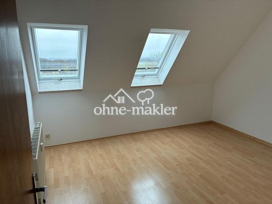 Sonnige 4-Zimmer-DG-Wohnung mit großem Südbalkon, Keller und Garage - Foto 1