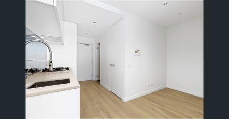 Positioned in the vibrant heart of Essendon, this stylish apartment is bathed in natural light and offers the perfect blend of comfort and convenience - Photo 2
