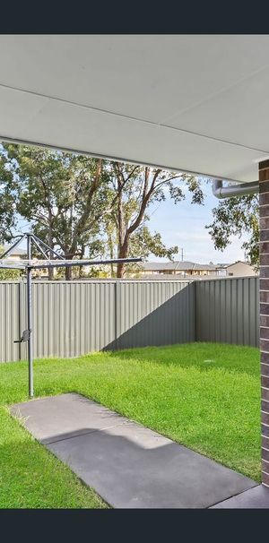 This immaculate two-bedroom unit is ideally located close to the Hunter Expressway, offering comfort and convenience. - Photo 1