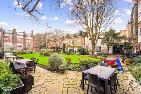 A contemporary split-level apartment located on a well-known street, offering direct entry to the communal garden. - Photo 5