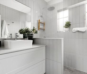 Charmingly renovated on a beautifully manicured block - Photo 1