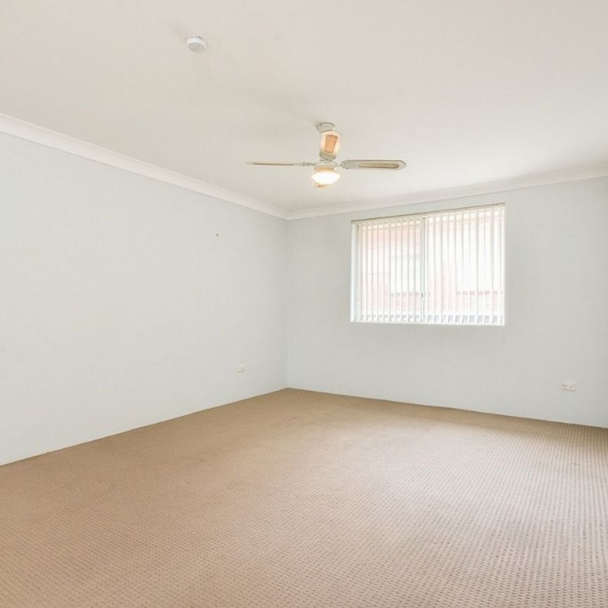 2 BEDROOM UNIT WITH GARAGE IN SMALL COMPLEX - Photo 1