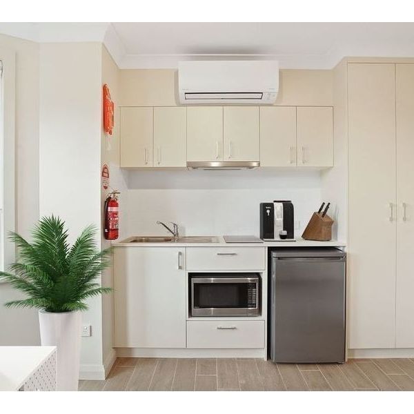 Centrally Located Designer Studio With Kitchenette and All Utilities Included - Photo 1