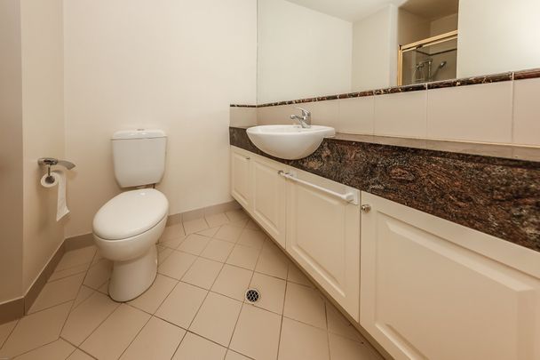 Sophisticated Partly Furnished Apartment with Parkside Views & Resort-Style Amenities - Photo 1