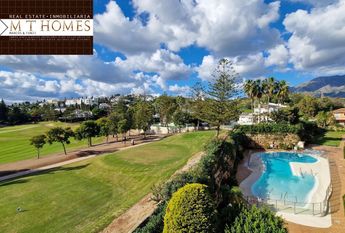 FULLY FURNISHED FRONTLINE GOLF APARTMENT WITH LARGE TERRACE BEAUTIFUL VIEWS - POOL AND A GARAGE
