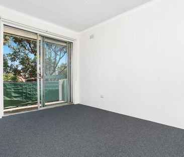 UPDATED TOP FLOOR TWO BEDROOM UNIT WITH CARSPACE - Photo 1