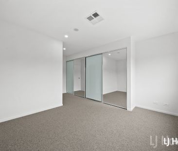 Stylish Split Level 2 Bedroom Home with Triple Garage - Photo 3