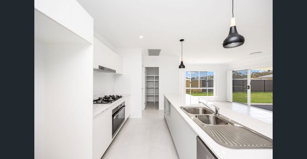 Near New Four-Bedroom Home with Ducted A/C & Media Room - Photo 1