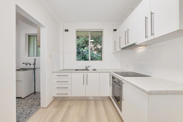 Top-Floor Two Bedroom Apartment in Perfect Location - Photo 1