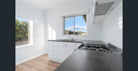 RENOVATED TWO BEDROOM UNIT WITH MODERN COMFORTS - Photo 5