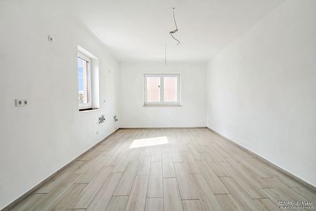 Moderne und großzügige Wohnung mit Einbauküche und Süd-Balkon - Foto 2