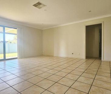 Well-appointed four-bedroom family home - Photo 1