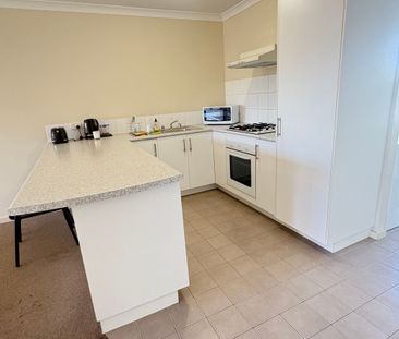 Tidy Unit in a Gated complex with sparkling pool! - Photo 1