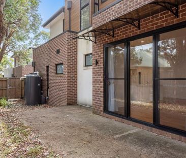 Modern Two-Story Brick Townhouse with Stylish Features - Photo 4
