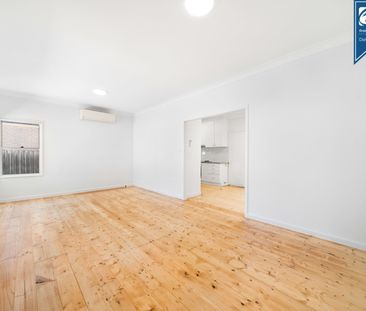 Charming Three-Bedroom Home with Freshly Landscaped Gardens - Photo 5