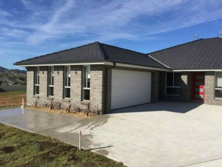 Modern 3-Bedroom Home with Double Garage & Spacious Living - Photo 2