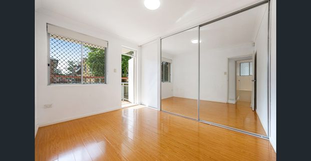 Bright and tidy two-bedroom brick unit with private balcony - Photo 1