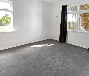 Spacious Three-Bedroom Home with Large Secure Backyard - Photo 5