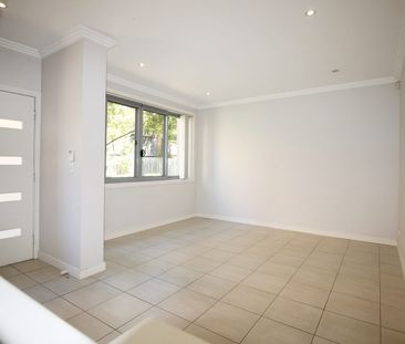 Quiet Secure Tri-level Townhouse with Distant City View & Internal ... - Photo 2