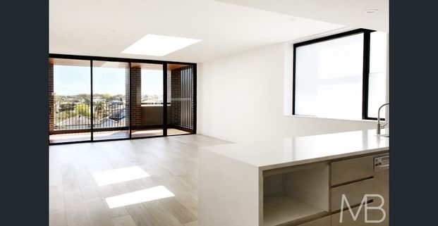 STUNNING TOP-FLOOR APARTMENT WITH SKYLIGHT & WATER GLIMPSES - Photo 1