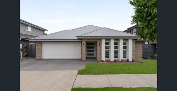 Lovely Family Home in Oran Park - Photo 1
