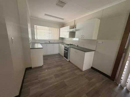 SPACIOUS FOUR BEDROOM, TWO BATHROOM HOUSE WITH 5X CARPORT - Photo 4