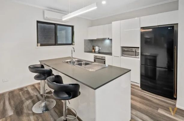 This stunning 3-bedroom, 2-bathroom townhouse in a boutique complex is now available for lease. - Photo 1