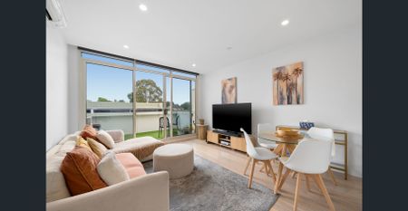 Stylish Modern Apartment Living with City Views - Photo 3