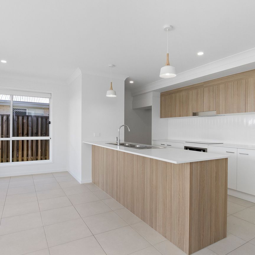 Brand New Designer Home with Alfresco Living in Thriving Caboolture South! - Photo 1