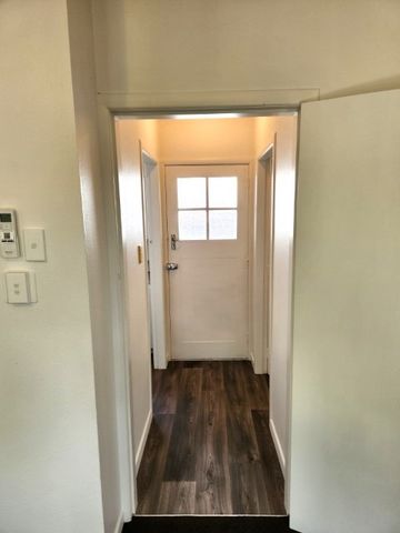 Step inside this beautifully recently renovated one-bedroom unit featuring new carpet, fresh paint, and new vinyl flooring throughout. - Photo 4