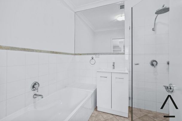 Freshly Painted Large Open Plan Two Bedroom Townhouse - Photo 1