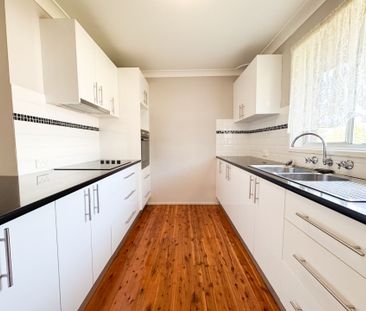 Peaceful Suburban Living in a Central, Well-Connected Location - Photo 1