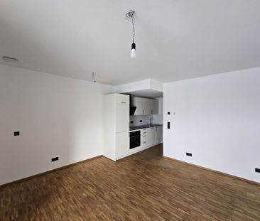 Gemütliche Singlewohnung mit Balkon und Einbauküche wartet auf Sie! - Photo 4