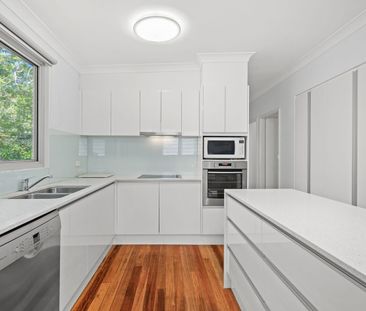 Elevated Three-Bedroom Home with Large Deck - Photo 4