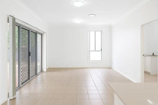 “Modern Family Living | 4 Bedrooms + Studio with Ensuite | Freshly Painted & New Carpet Throughout” - Photo 1