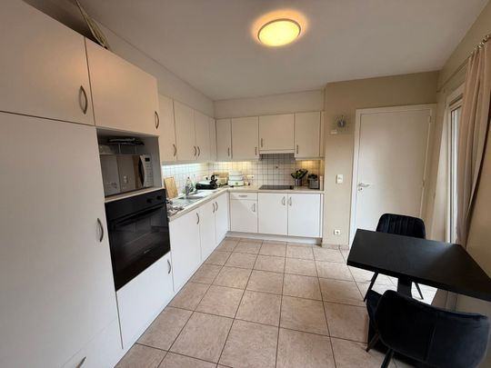 GELIJKVLOERSAPPARTEMENT MET TERRAS EN GARAGE IN HET CENTRUM VAN TIELT. - Photo 1