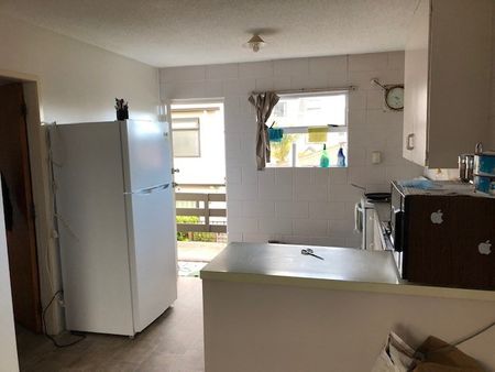 Tidy and spacious, this one-bedroom upstairs flat sits in a quiet block of six and is just a short walk from Waikato University — making day-to-day living super convenient. - Photo 5