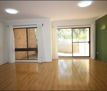 Convenient Townhouse in a Prime Location - Photo 1