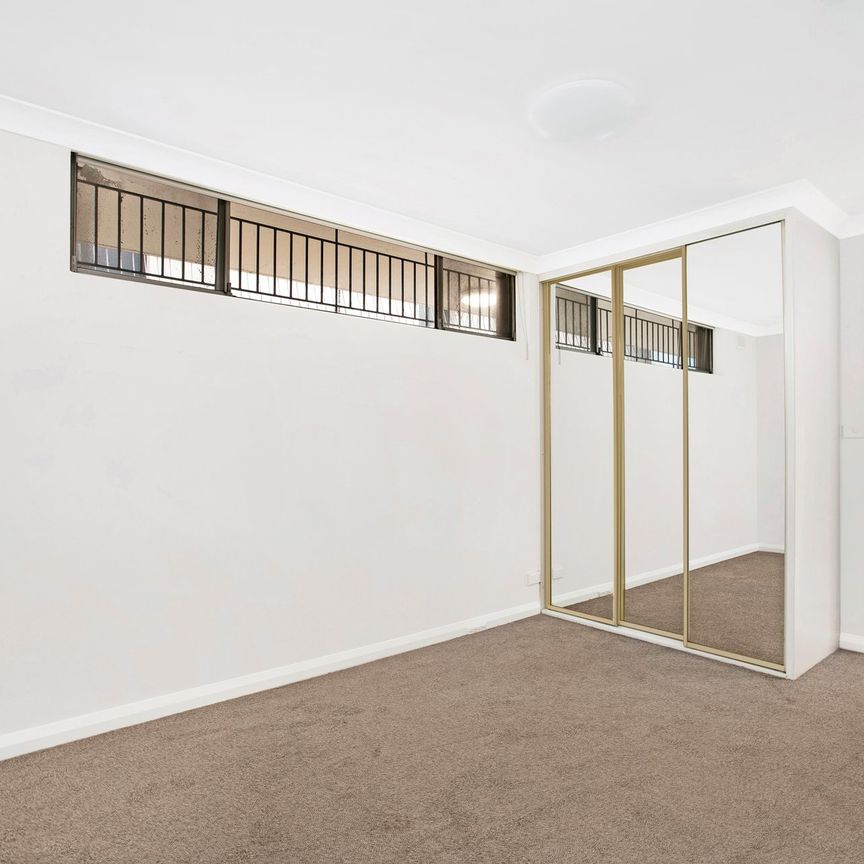 Ultra Convenient Apartment with Secure Garage - Photo 1