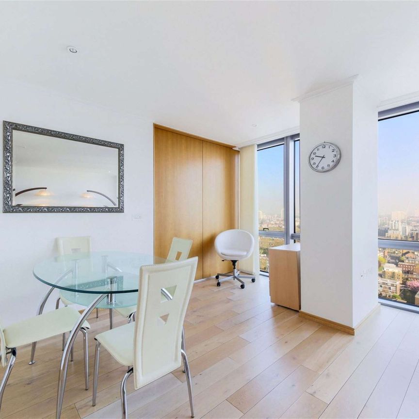 A bright 2 bedroom apartment situated on the 19th floor of this prestigious dockside development located close to the heart of Canary Wharf's business district. - Photo 1