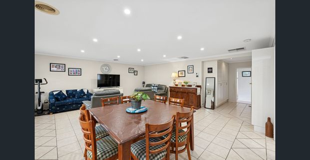 Three-Bedroom Home with Multiple Living Areas Near Modbury Hospital! - Photo 1