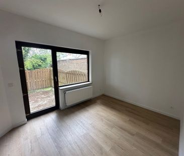 Gelijkvloers één-slaapkamer-appartement met ruim terras - Photo 4