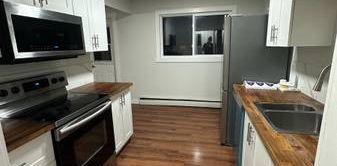 Spacious 2bd apartment with ALL utilities & assigned parking included - Photo 2