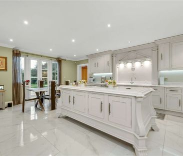 Set within a prestigious private estate, this impressive six bedroo... - Photo 6