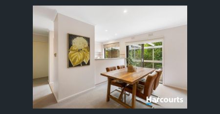 Elegant Brick Home with Serene Garden Surrounds - Photo 4