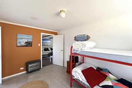 Live the Coastal Lifestyle – Furnished 4-Bedroom Retreat Steps from White Beach - Photo 5