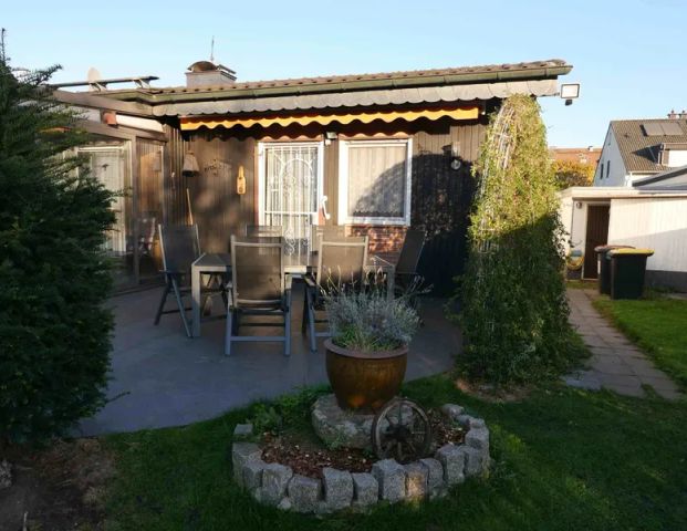 Freistehender Bungalow mit 2 Garagen in ruhiger Wohnlage von Moers-Scherpenberg - Foto 1