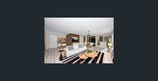 Spacious Family Retreat with Dual Living Areas and Prime Location - Photo 1