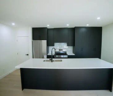 $2,100 – Designer 3-Bedroom Main Floor Unit| Gourmet Kitchen, 2 Spa... - Photo 1