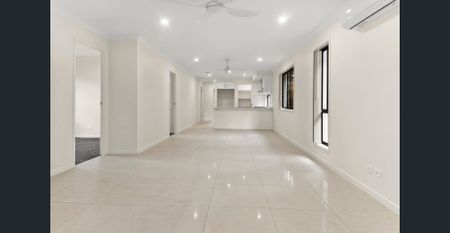 Rent Now! Ideal 4-BR Home with Tiled Living Areas & Lock-Up Garage! - Photo 4